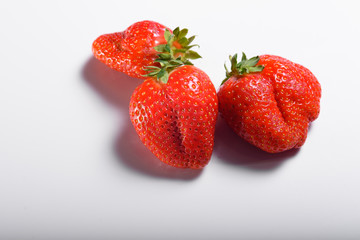 Fresh organic strawberries isolated on a white background. Delivery of natural products. Packaging made from organic strawberries.