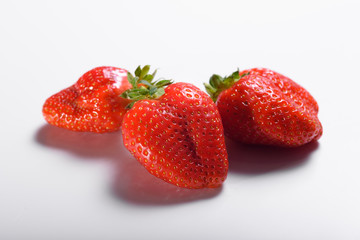 Fresh organic strawberries isolated on a white background. Delivery of natural products. Packaging made from organic strawberries.