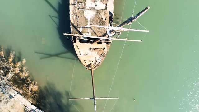 Flyby of sunken boat rusty drone overhead