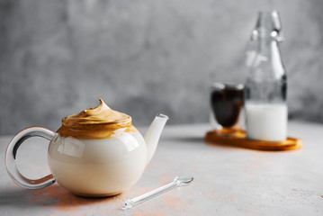 Dalgona Coffee in glass pot,Korean trendy home made coffee, a drink in isolation at home