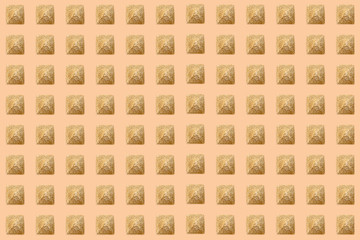 Pattern of golden sand pyramids on a beige background. Minimal tourism background texture. Creative layout. Top view