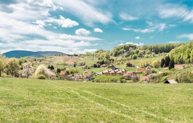 rural mountain landscape with green fields and blue sky.
countryside landscapes.
