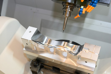 The  5 axis CNC milling machine cutting the  automotive mold parts with solid ball endmill tools....