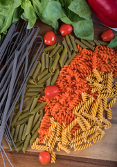 Assortment of different types of gluten-free penne pasta from chickpeas, red lentils, peas