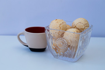 Brazilian snack cheese bread and cup of coffee on with background