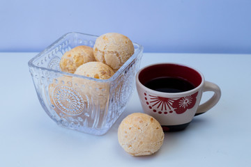 Brazilian snack cheese bread and cup of coffee on with background