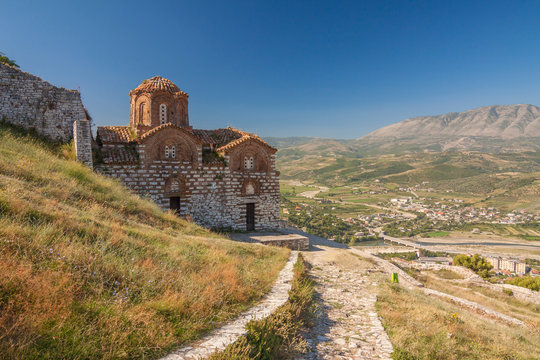 Albania - Berat - The medieval stone byzantine orthodox Holy Trinity church on the hill of old Berat castle with valley behind