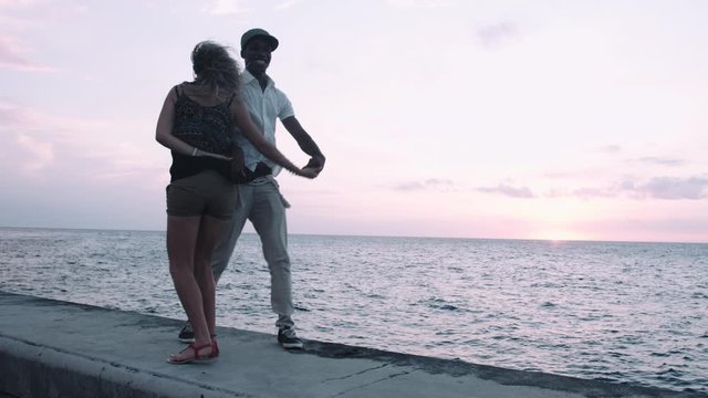Looping video of Latin Couple salsa dancing at sunset with animation 4K dancer.