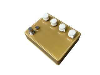 Isolated Gold boutique vintage Overdrive stomp box effect for electric guitar on white background with work path. Side view photos.