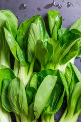 Top view green bok choy ready to cook on. chopping stone.