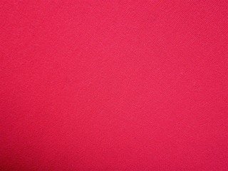 Texture of bright pink fabric for backgrounds.
