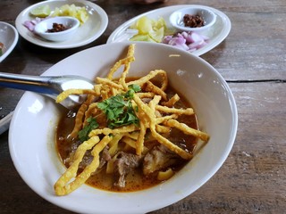 thai traditional northern yellow noodle with beef in a thick soup called Khao Soi