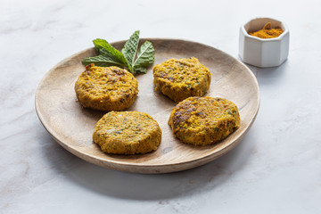 Vegan curry burgers on wooden plate with white background.Concept Health food. Selective focus