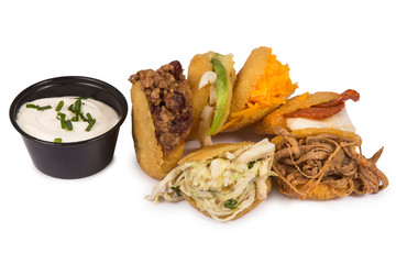 Arepa de huevo. Traditional Colombian fried arepa filled with egg and shredded meat isolated on a white. Lunch, mays.