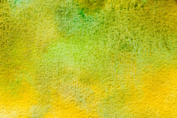 Abstract hand painted watercolor background. Green, yellow and brown shades