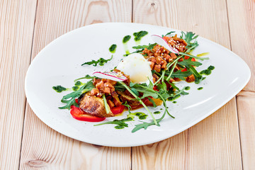 A plate of nicoise salad on a table