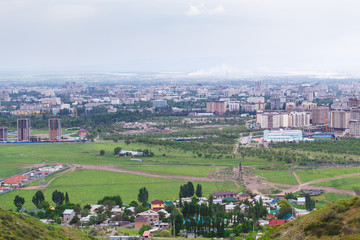 View of the city from the mountain. Summer landscape. Kyrgyzstan, Bishkek