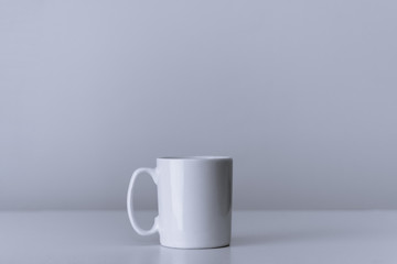 Porcelain mug for coffee and tea on white background