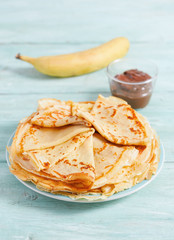 fresh crepes on wooden surface