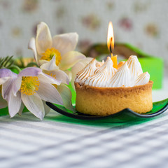 Fototapeta na wymiar Delicate white flowers and cake with white cream