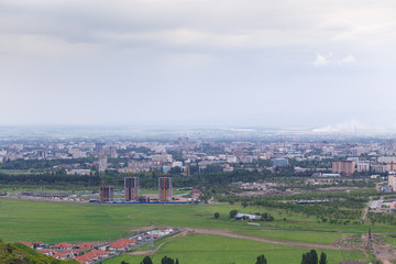 View of the city from the mountain. Summer landscape. Kyrgyzstan, Bishkek