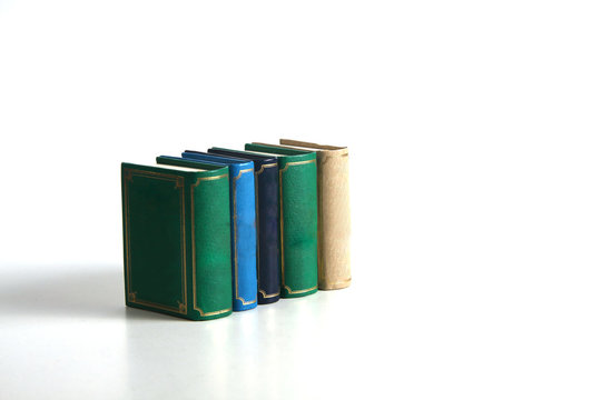 a pile of books isolated on white background. Image contains copy space
