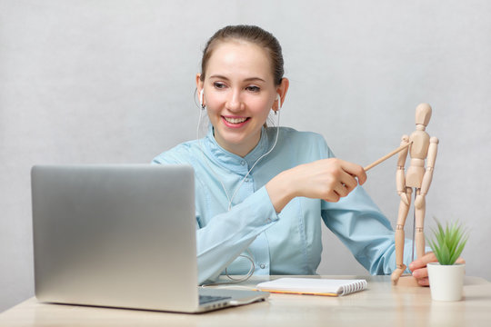 Doctor Student Is Taking Exams Online Showing Answers On A Mannequin.