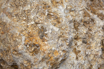 the surface of a yellow stone with a brown tint