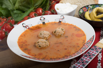 Top view of plate with meatballs soup, traditional plate of the Romanian cuisine,ciorba de perisoare