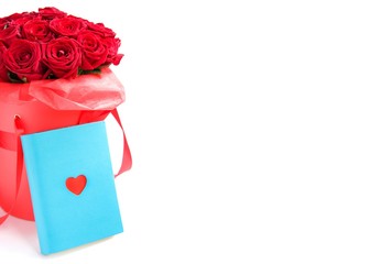 Luxury red roses in paper hat box and boom with heart on white background. Romantic gift for girl or woman