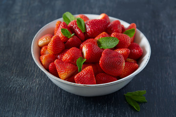 strawberries on a dark wooden surface