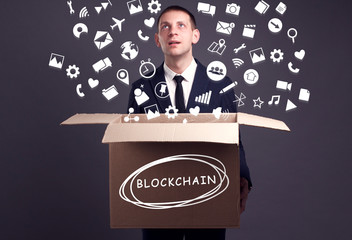 Business, technology, internet and network concept. A young businessman collects information to become successful: Blockchain