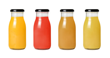 A row of bottles with different juice on a white isolated background. Clipping path.