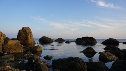 Fototapeta na wymiar Rocky shore. Beautiful seascape. Composition of nature.