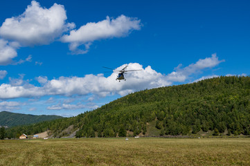 takeoff and landing helicopter in the mountains