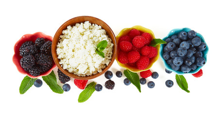 fresh cottage cheese and berries isolated on white