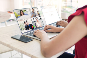 Work at home and social distancing concept, woman talking to her colleagues about plan in video conference in house, meeting and planning online as covid 19 or corona virus disease