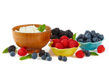 fresh cottage cheese and berries isolated on white