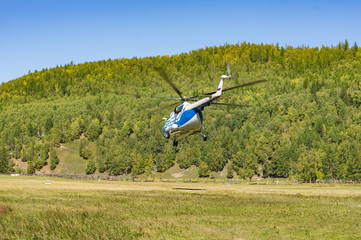 takeoff and landing helicopter in the mountains