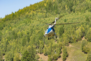 takeoff and landing helicopter in the mountains