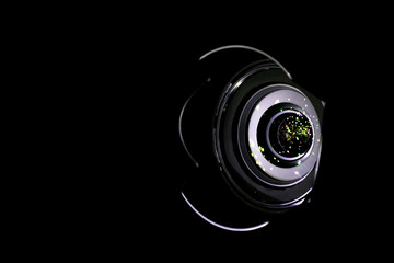 Lense light. Flare reflection on photo, video camera on black background. Gleams rounded and...