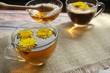 Cup of healthy dandelion tea and honey. Herbal medicine.