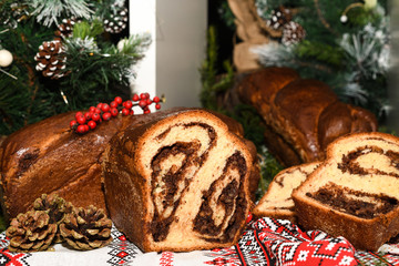 Closeup of slices of homemade traditional Romanian sweet bread named "cozonac", with cacao, raisins