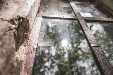 view of an old historic wooden closed window of an old building in the woods