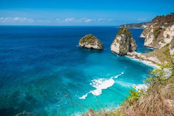 Tropical Diamond beach with blue ocean and cliff in Nusa Penida