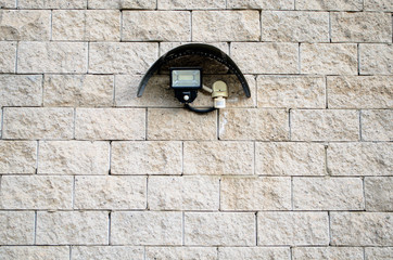 Motion sensor on the wall on the outside of the building