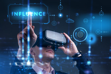 Business, Technology, Internet and network concept. Young businessman working on a virtual screen of the future and sees the inscription: Influence