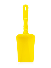 Yellow shoulder blade on a white background. Plastic shovel for playing in the sandbox. Blank for advertising children's toys, mock up