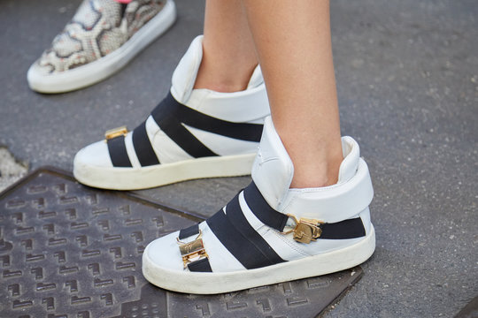 Woman With Giuseppe Zanotti White Sneakers Before Versace Fashion Show, Milan Fashion Week Street Style On June 17, 2017 In Milan, Italy