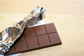 Chocolate bar in silver foil.